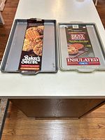 Both Ekco insulated baking sheets side by side showing size and inserts