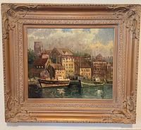 Front view of framed harbor painting
