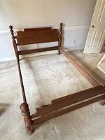 Full bed frame assembled showing headboard, footboard and rails