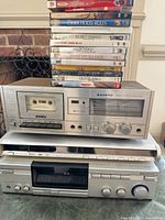 Front view of cassette deck, DVD player, receiver and DVD stack