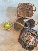 All baskets, plate and pears on carpet