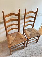 Front view of both ladderback chairs side by side