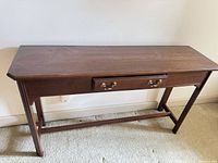 Full view of mahogany console table front and top