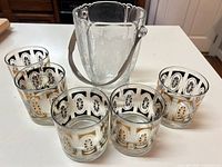 Full view of ice bucket and surrounding lowball glasses showing complete set