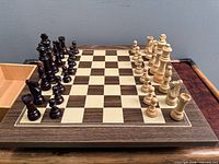 Full chess set on board with pieces arranged