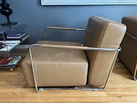 Side view showing tan leather upholstery and tubular chrome frame