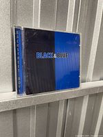 Front of jewel case showing Black & Blue cover