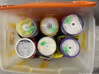 Overhead view of six disc spindles inside bin