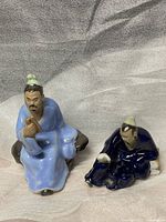 Both ceramic scholar figurines front view