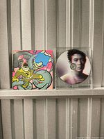 Front cover artwork and jewel case with disc visible