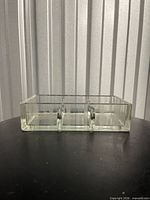 Rectangular glass tray front view showing three compartments