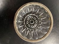 Top view showing cut crystal pattern and silver rim