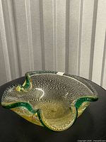 Top view showing freeform shape, green rim, aventurine flecks