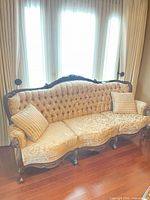 Front view of brocade sofa with cushions
