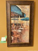 Full view of framed canvas artwork depicting café scene