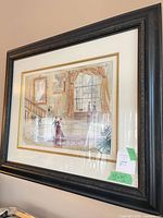 Full view of framed watercolour painting in black frame