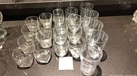All 21 glasses arranged on countertop showing both sizes