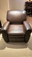 Front view of dark brown PU leather recliner armchair