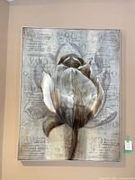 full view of framed textured canvas art with metal flower