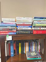 Shelf top showing current-affairs and economics titles such as Six Faces of Globalization, Power and Progress, Numbers Don’t Lie, SuperFreakonomics, Titans, How the World Really Works, Rick Mercer, MegaThreats