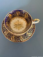 Aynsley cobalt blue and gold teacup interior and saucer