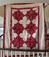 Full front view showing red and white log cabin pattern