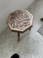 Top view showing carved flower and ribbon design on octagonal surface