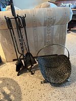 Full view of fireplace tool set and log holder