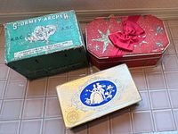 Three antique cardboard boxes arranged together