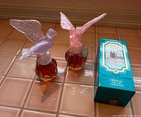 Two Delagar Royal Dove perfume bottles with colored stoppers and boxed 4711 cologne