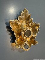 top view of gold leaf-shaped candleholder