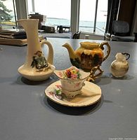 Group shot showing all five miniature items