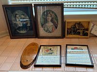 All six wall hangings displayed together on windowsill