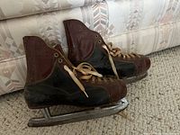 pair of skates side view showing two-tone leather