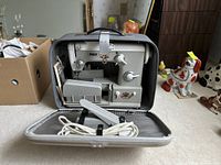 Pfaff 360 sewing machine inside its hard portable carrying case with foot pedal stored below