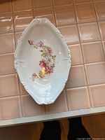 Porcelain oval serving dish with small floral transfer