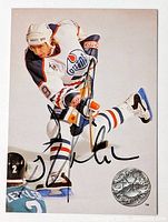 Front of card displaying action photo, Oilers logo, autograph visible