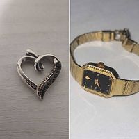 Front view of sterling silver open heart pendant and gold-tone Bulova wristwatch