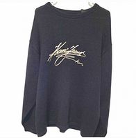 Front view of navy knit sweater with embroidered Kani Jeans logo