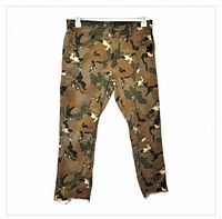 Front view of LRG camouflage tapered pants with raw hems
