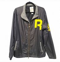Front view of Reebok Classics jacket on hanger showing yellow R logo and zip pockets