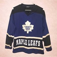 Front view showing crest, MAPLE LEAFS text, and color scheme