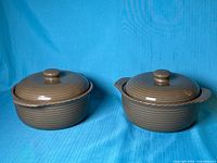 Both Roscher stoneware bean pots with lids displayed closed