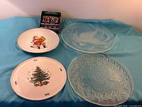 Overview showing two porcelain and two glass plates plus boxed spreaders