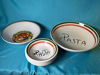 All six bowls: two large, four small, showing designs and sizes