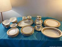 Entire set laid out showing all place settings and platter