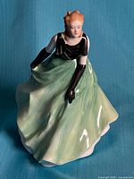 Front view of Royal Doulton Vanessa figurine showing gown, bodice, face