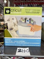 Front of boxed Cricut Jukebox showing product image and features