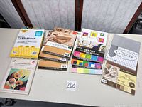 All nine paper packs laid out on table