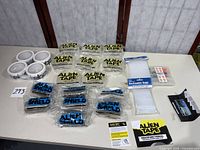 Full lot overview with Alien Tape, Alien Shield, packing tape rolls, WorkChoice kit, Darice reclosable bags